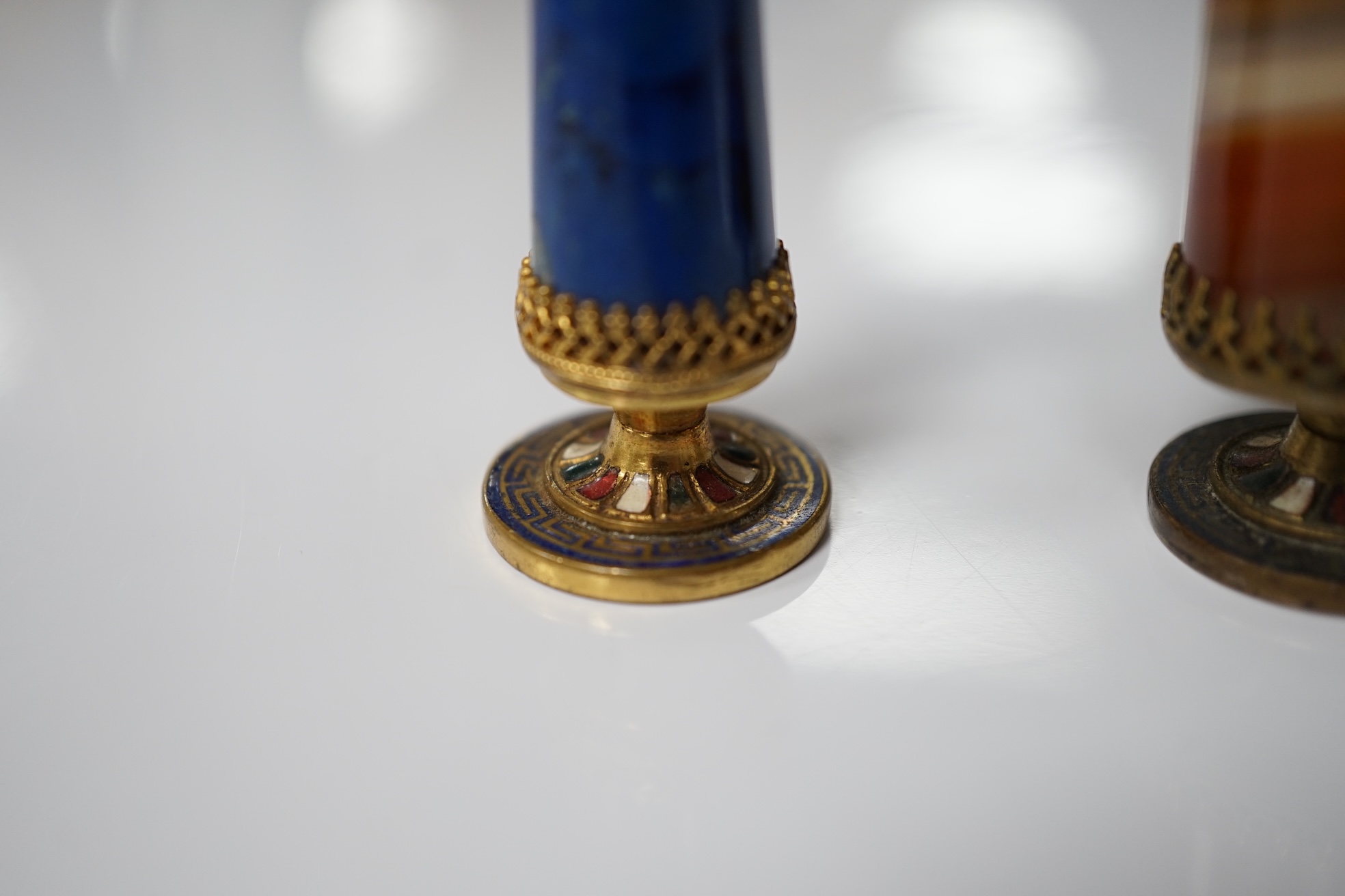 A 19th century agate and gilt metal table seal with gilt snake decoration and a smaller lapis lazuli seal, tallest agate seal 7cm high (2). Condition - fair